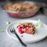 a head on image of Rhubarb Oat Crumble on a white plate.