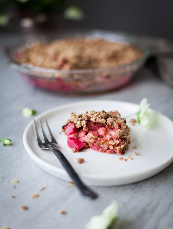 a head on image of Rhubarb Oat Crumble on a white plate.