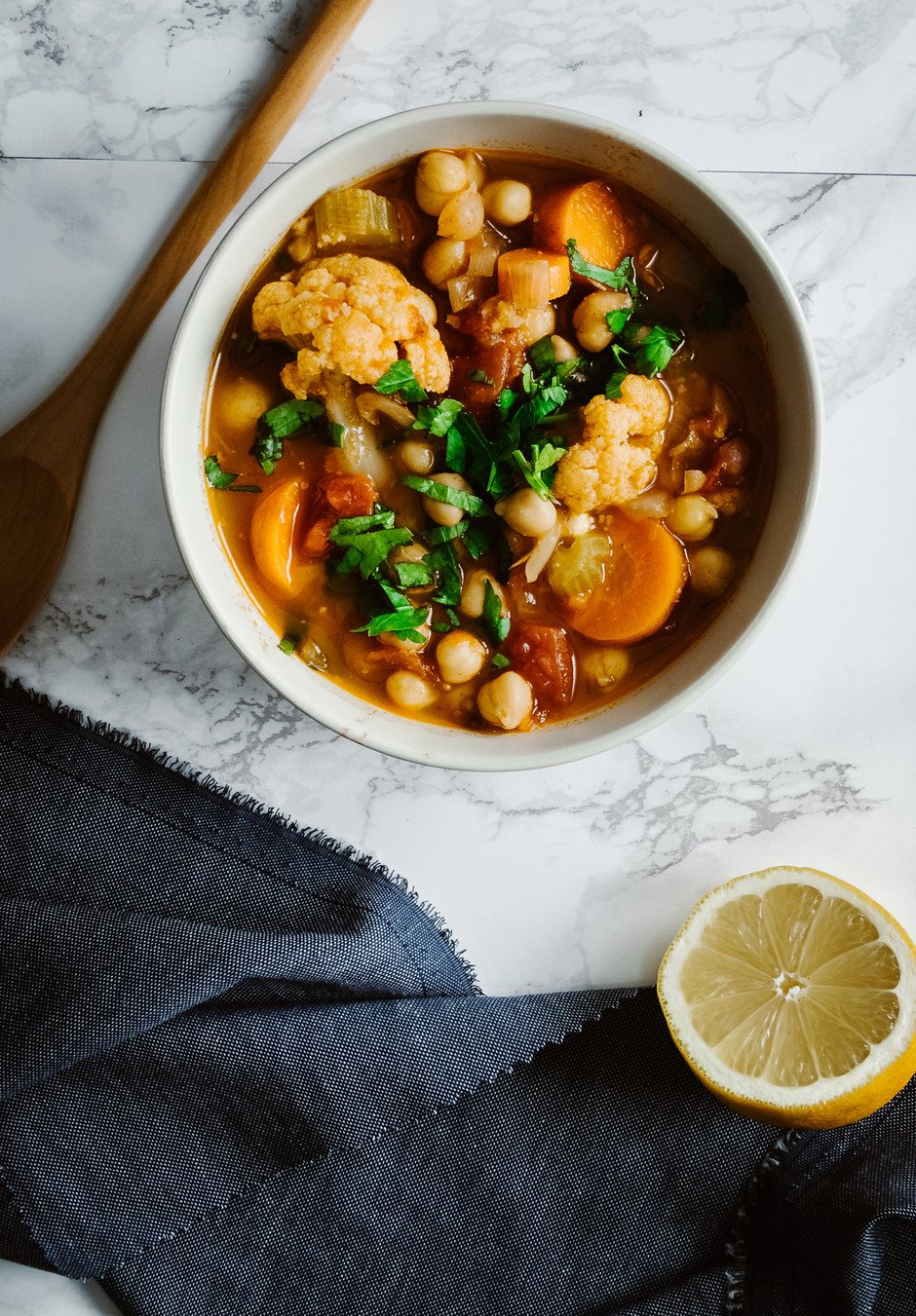 an overhead image of a bowl of Moroccan-Style Chickpea & Cauliflower Soup.