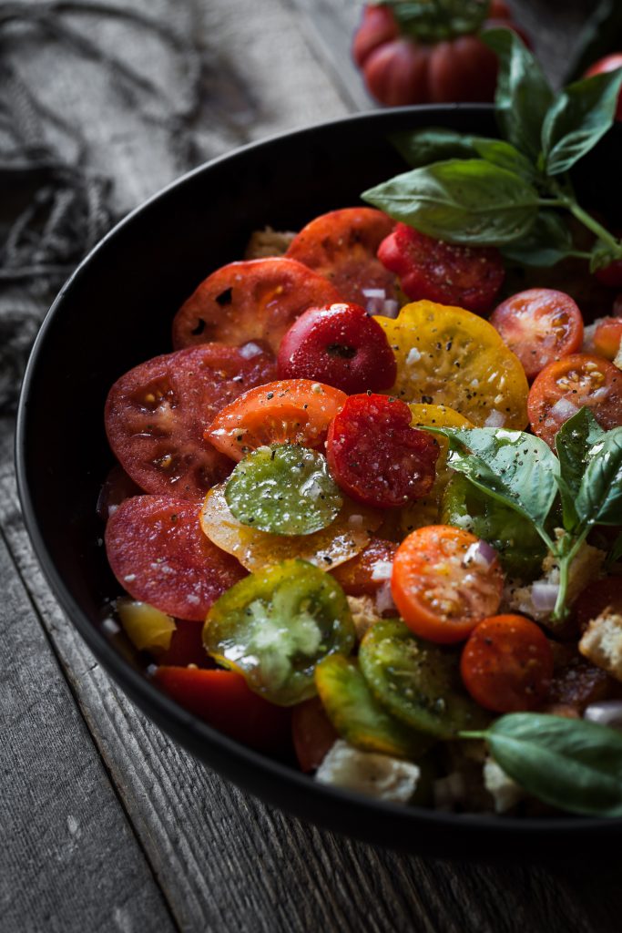 angled closeup view of tomato panzanella salad.