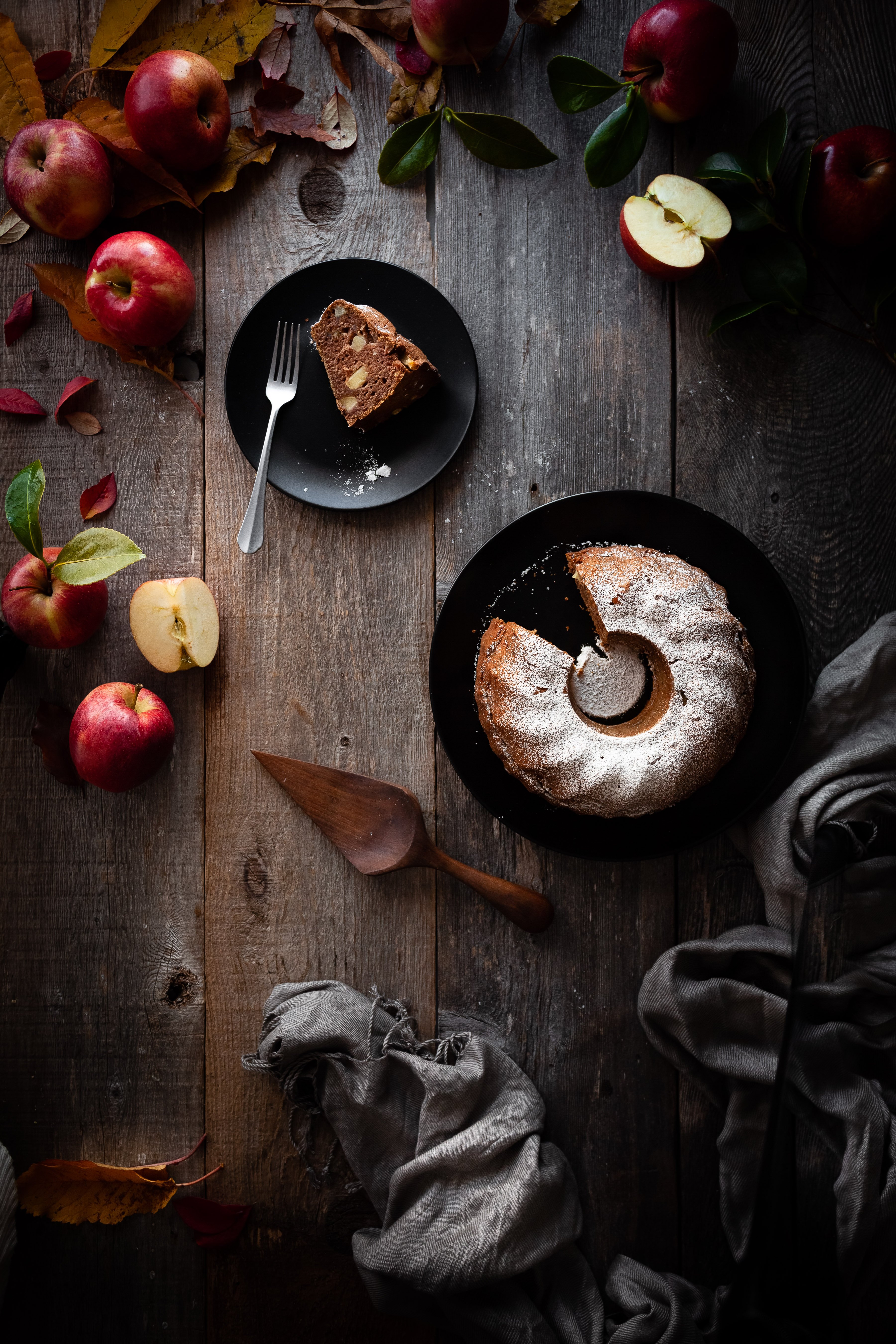 overhead image of vegan apple spice cake with slice removed.