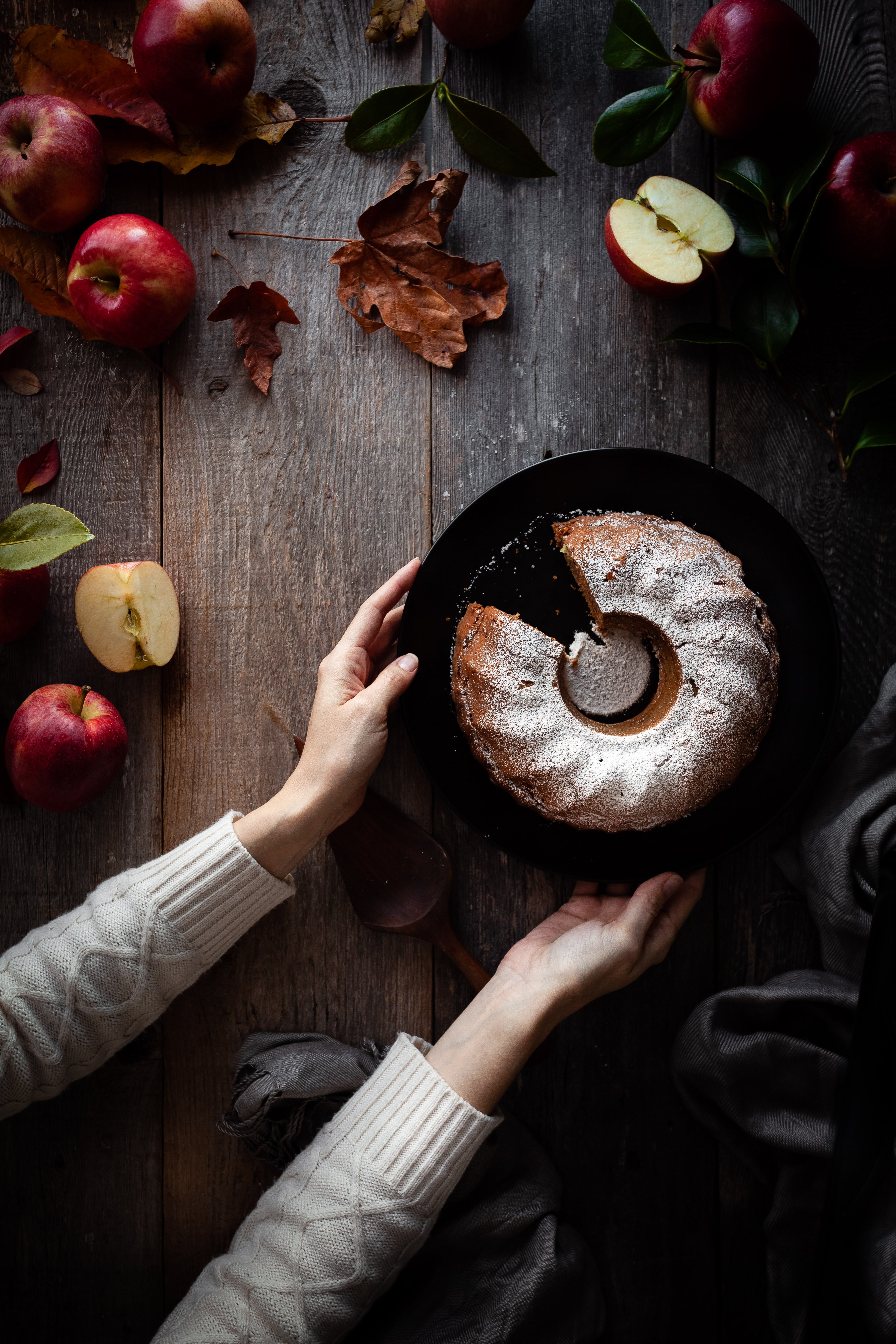 overhead image of vegan apple spice cake with slice removed.