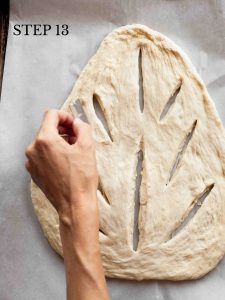 a baker using a razor to slash the bread dough with a pattern resembling leaf veins with text overlay "step 13"